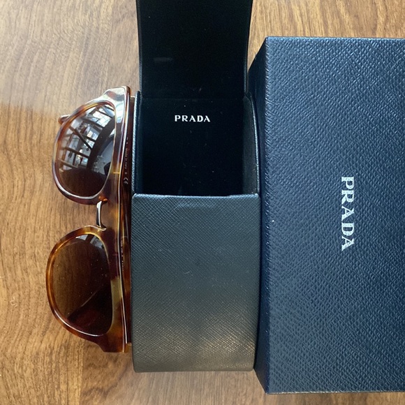 Prada Accessories - Prada sunglasses; tortoise frames; original case and box unisex